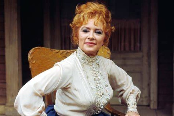 Amanda Blake as Kitty Russell and Milburn Stone as Doc Adams and in